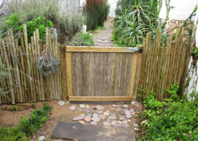 Rustic garden fence and gate of latte